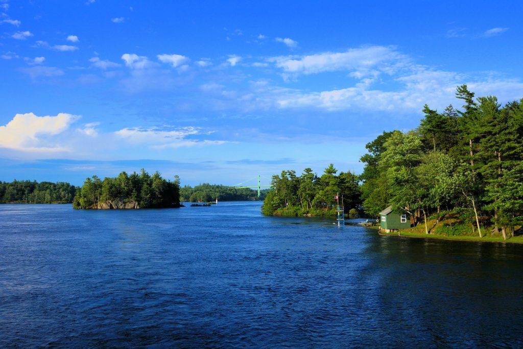 A river scene with islands and trees along the side.