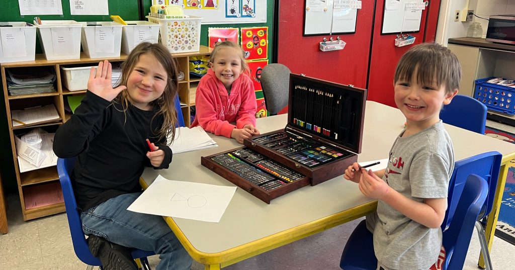 image of elementary students with art kit