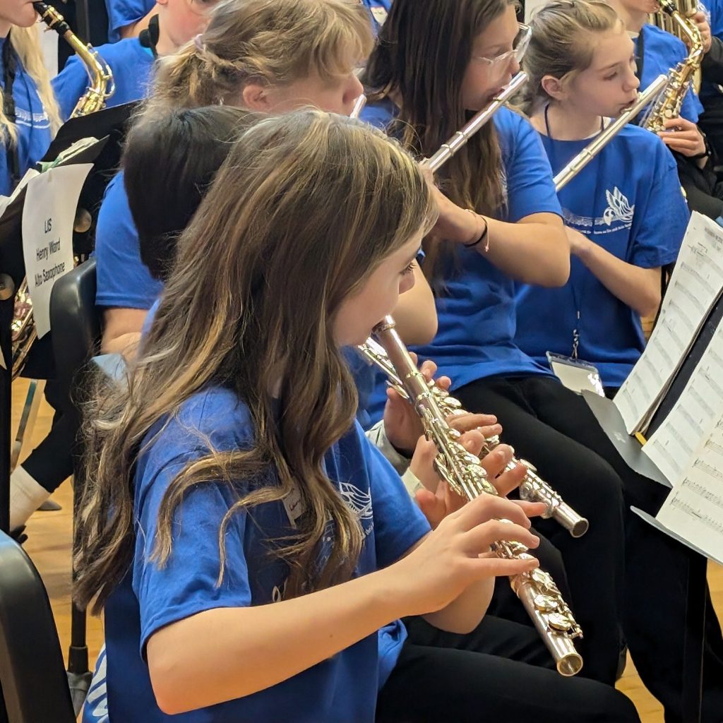 student plays the flute