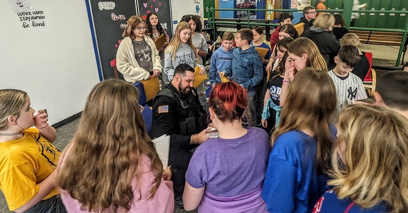 Students at Madill giving thank you letters to Patrolman Daniel Hollister