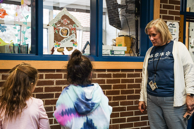 Principal talks with Kindergartners about the Gingerbread Boy