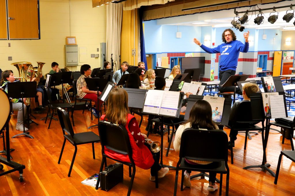 students in small group instrument instruction