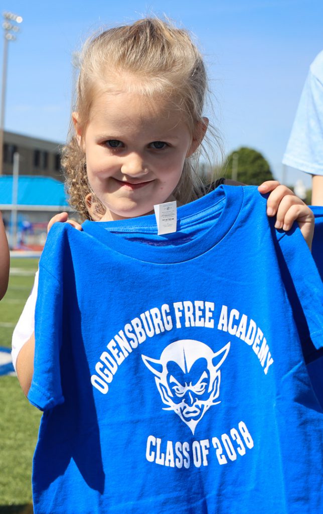 A JFK student holds up a Class of 2038 tshirt.