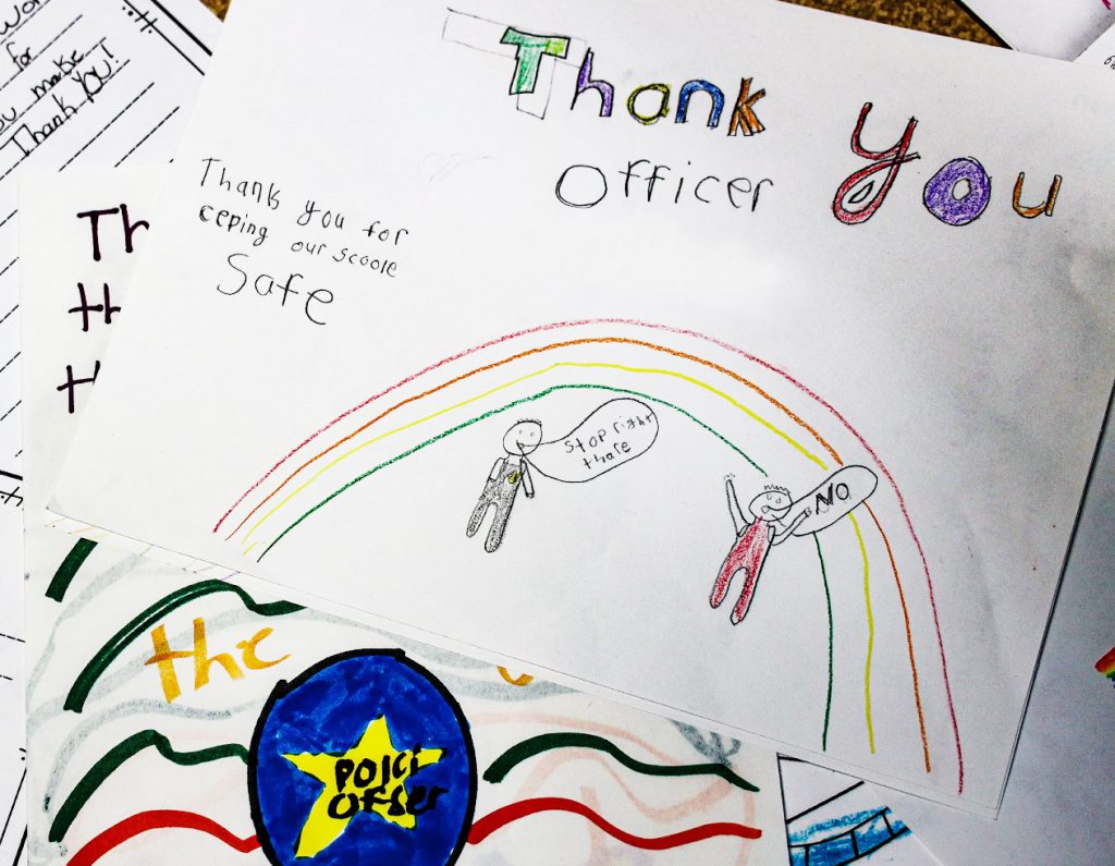 A child's drawing that says "thank you officer Hollister for keeping our schools safe".
