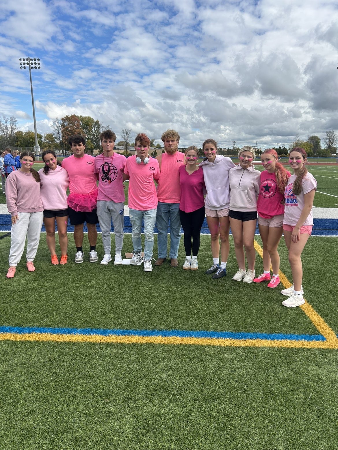 Collection of students on the athletic field