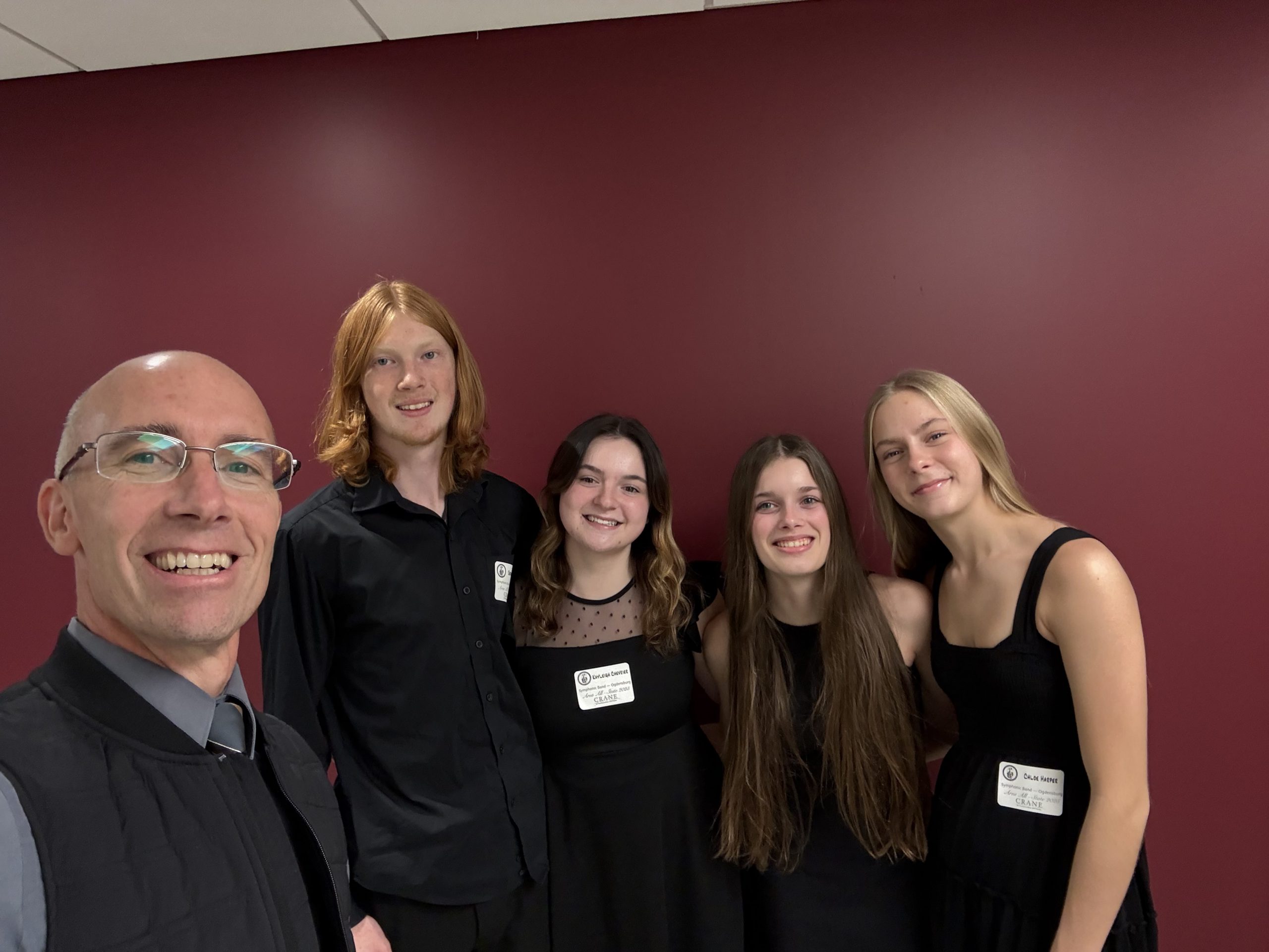 Teacher with a group of high school band students