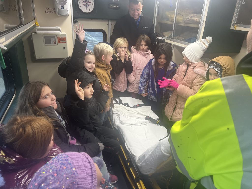 Group of elementary students in an ambulance