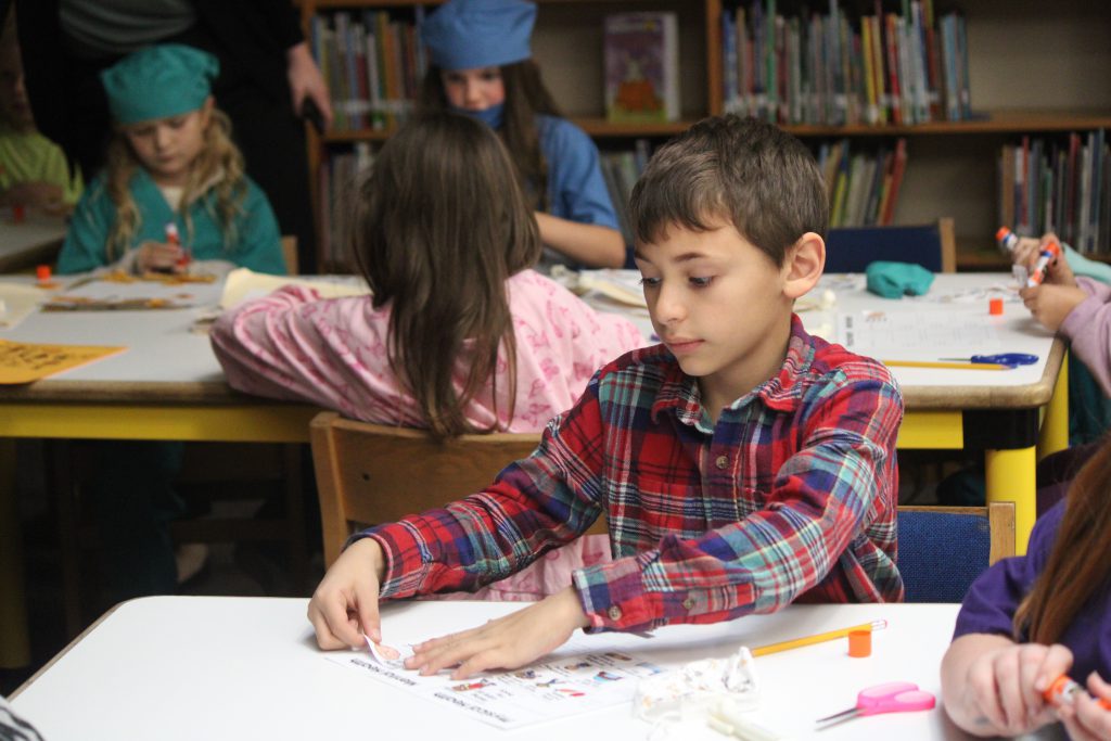Male elementary student working on a classroom activity
