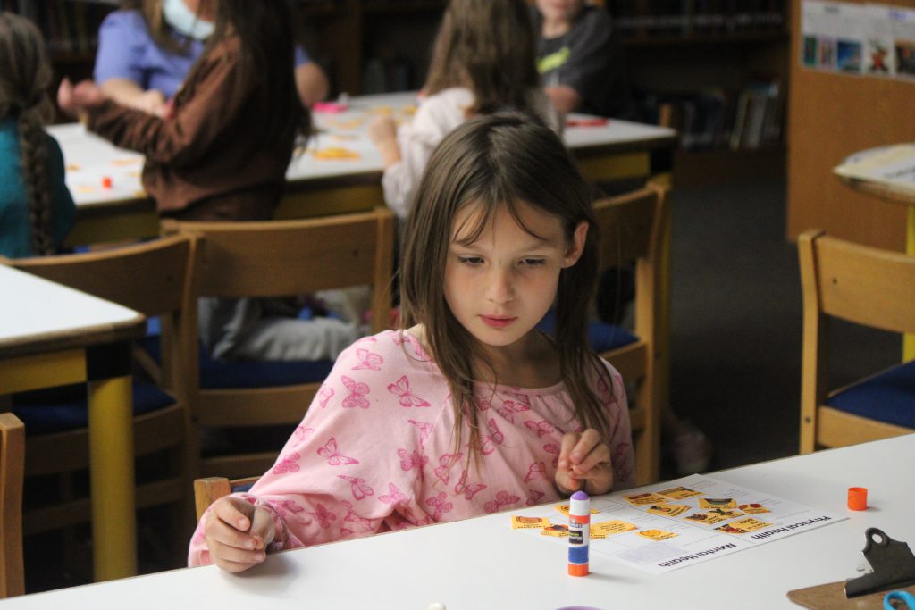 Female elementary student working on a class activity