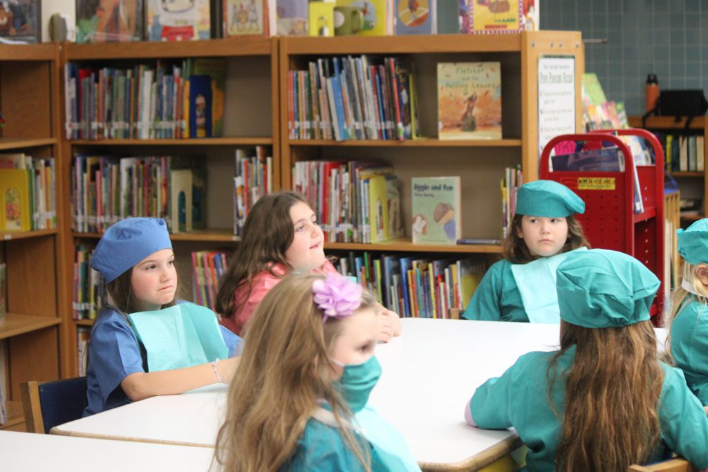 Group of elementary students sitting at a table