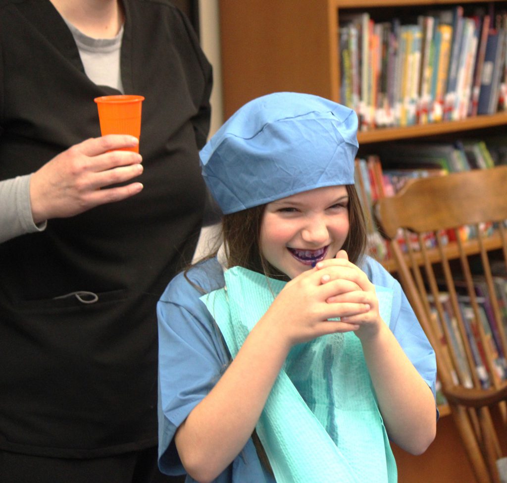 Female elementary student smiling
