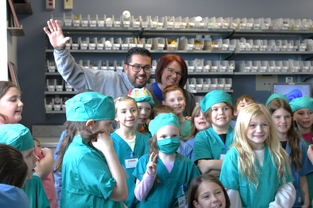 Group of elementary students with hospital staff