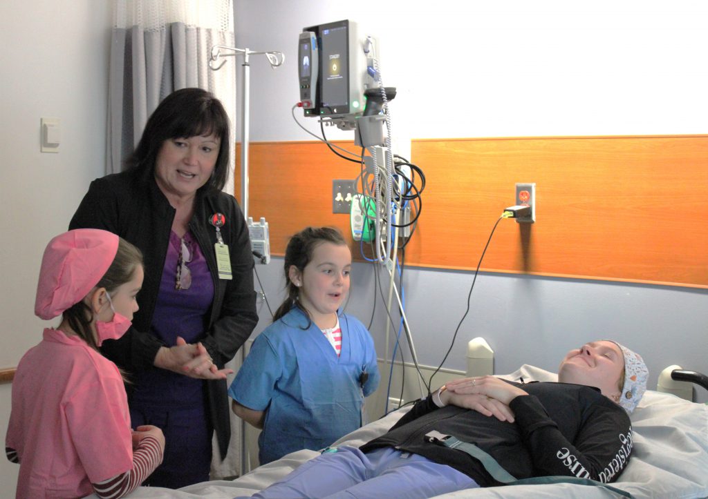 Elementary students with hospital staff members