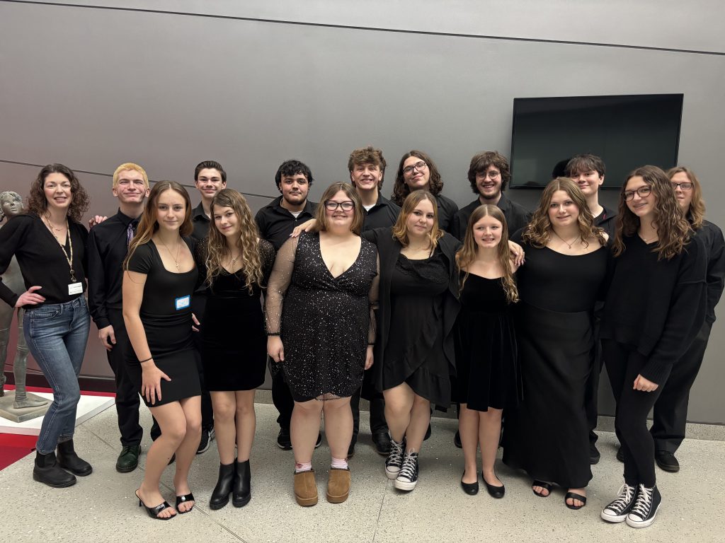 Large group of teenage students smiling