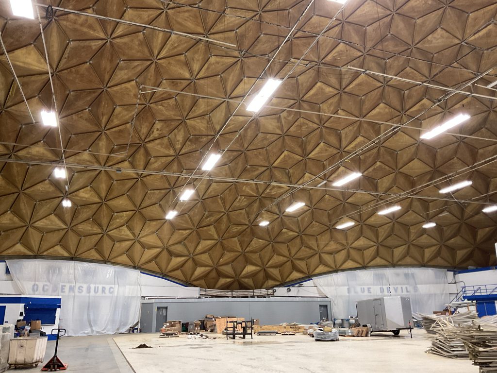 Building interior with construction materials and exposed ceiling