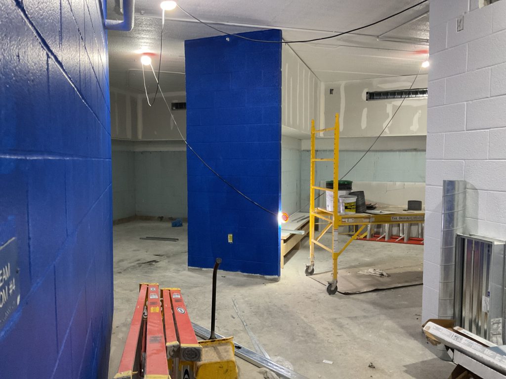 Building interior with ladders and lifts