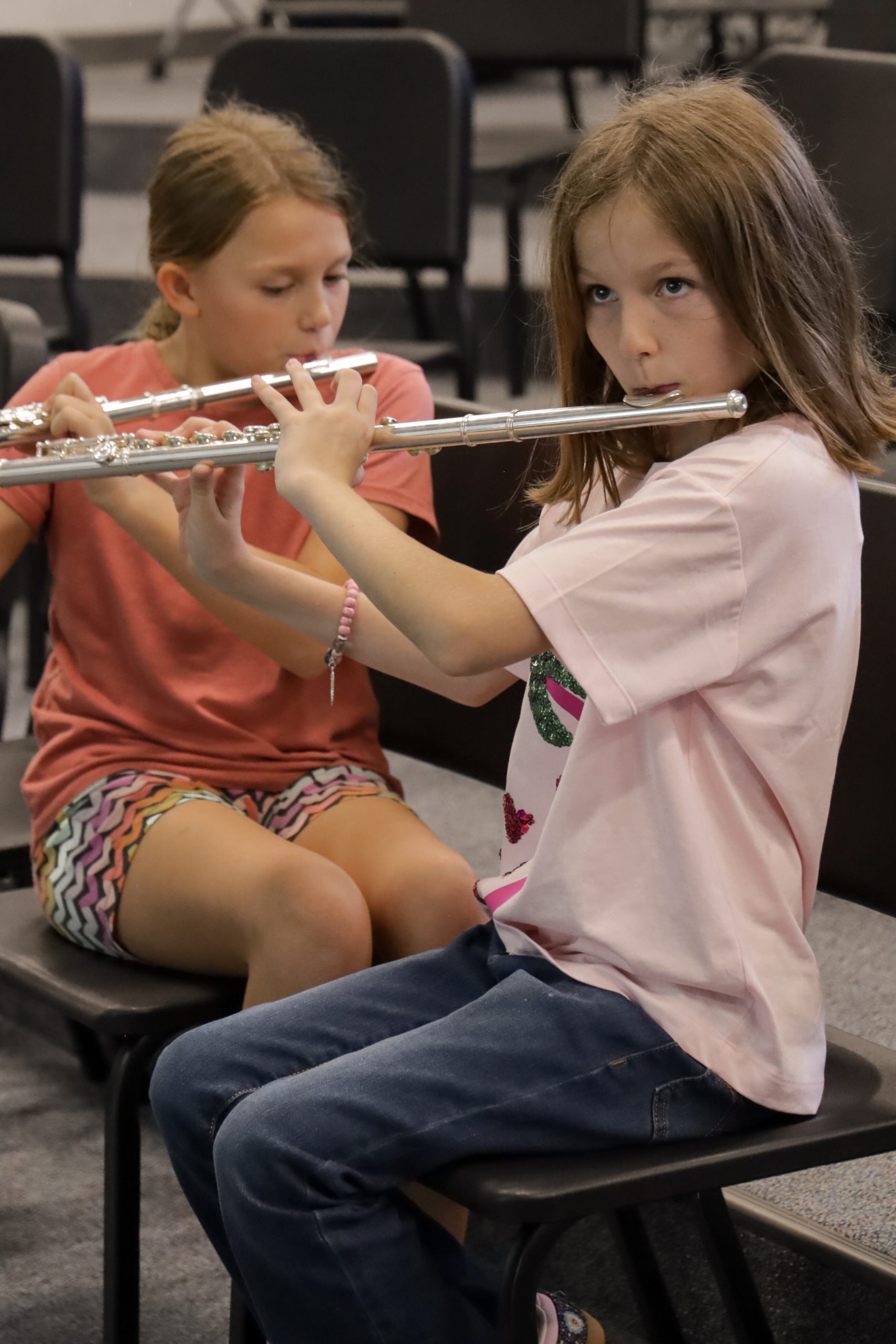 elementary students playing flute