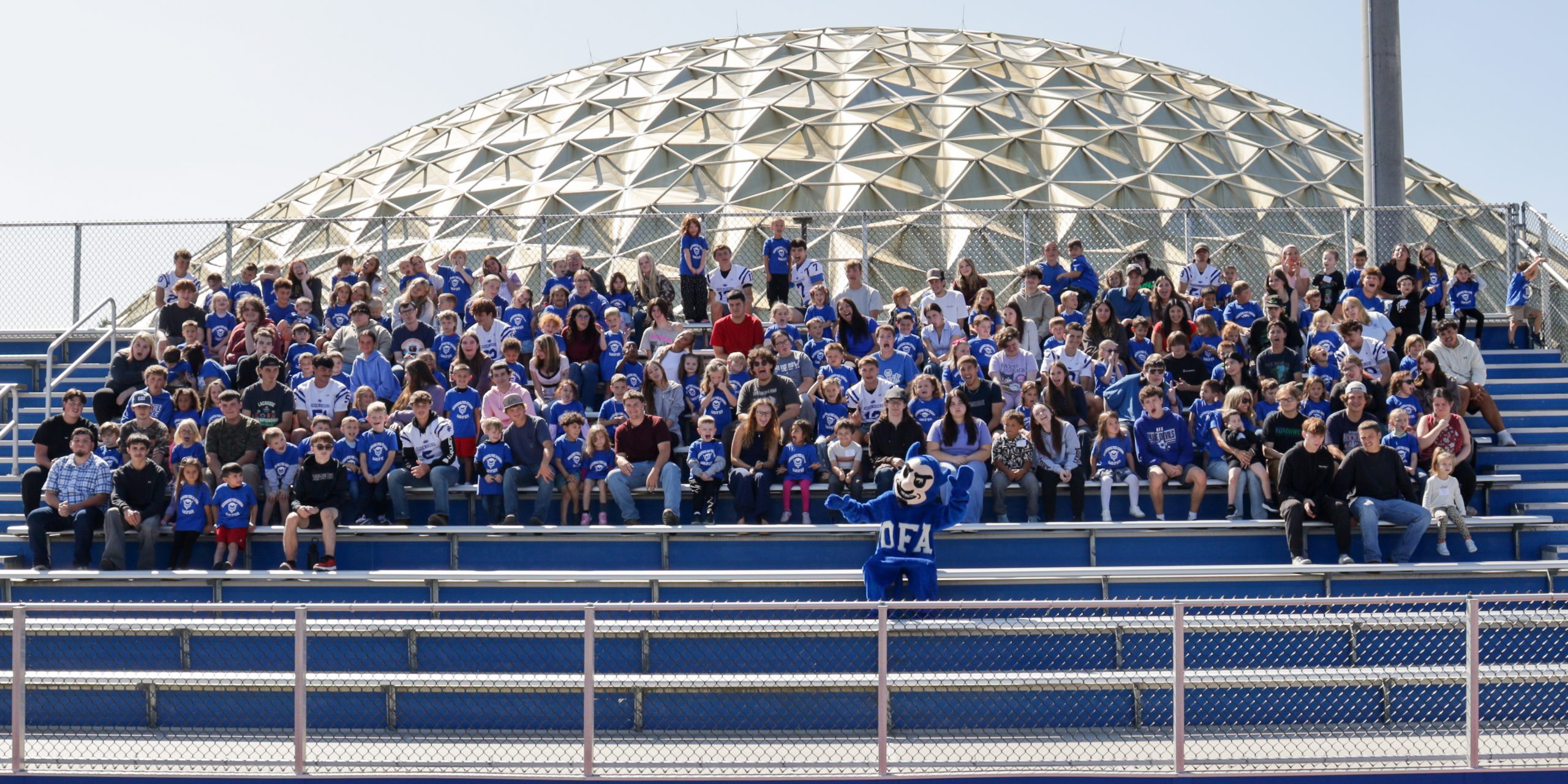 students in front of the dome